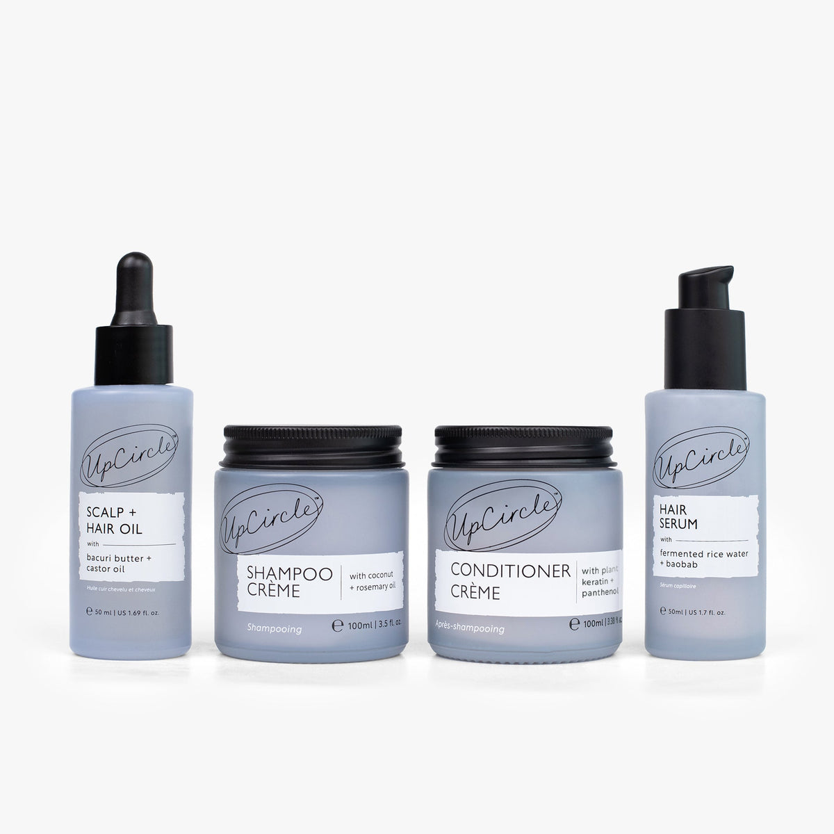 UpCircle haircare bundle with shampoo, conditioner, scalp oil, hair serum in gray bottles on Tampa Home & Garden Store