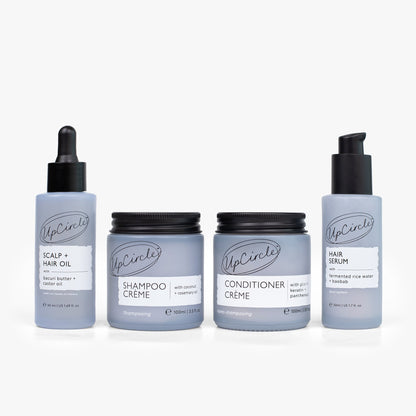UpCircle haircare bundle with shampoo, conditioner, scalp oil, hair serum in gray bottles on Tampa Home & Garden Store