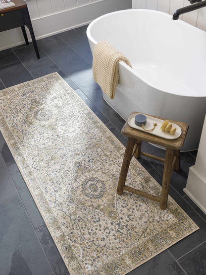 Cara Flat Pile Washable Rug by Boutique Rugs in beige tones beside a white bathtub on Tampa Home & Garden Store