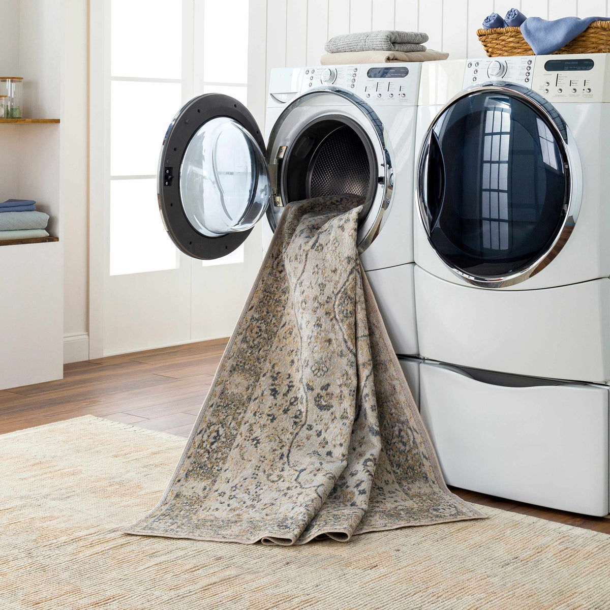 Cara Flat Pile Washable Rug beige-gray rug draped over washers Boutique Rugs on Tampa Home & Garden Store