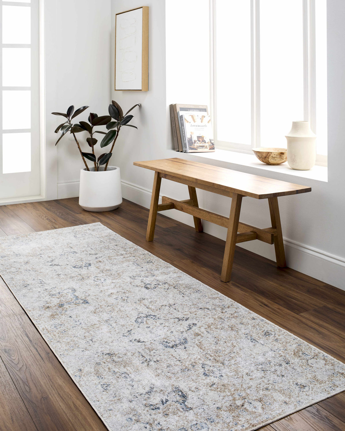 Dobry Boutique Washable Rug, light gray-blue patterned rug on wood floor in a living area on Tampa Home & Garden Store