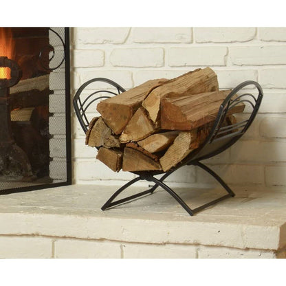 Black metal farmhouse firewood holder log rack with curved sides by fireplace on Tampa Home & Garden Store