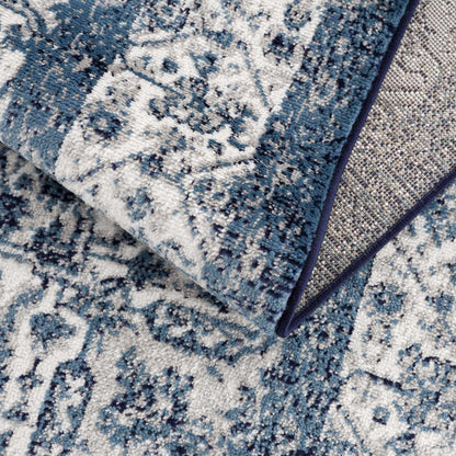 Billy Area Rug by Boutique Rugs in blue and white abstract pattern with navy binding edge on Tampa Home & Garden Store