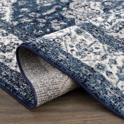 Billy Area Rug blue and white abstract pattern, two Boutique Rugs with dark blue edging, stacked on wood floor on Tampa Home & Garden Store