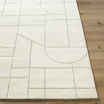 Boutique Rugs Fusao off white area rug with muted grid pattern on wood floor on Tampa Home & Garden Store