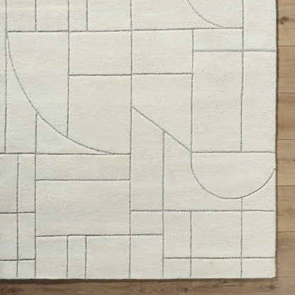 Fusao Off White Area Rug with gray geometric grid pattern by Boutique Rugs on wood floor on Tampa Home & Garden Store