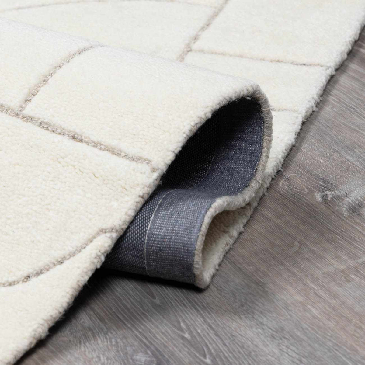 Fusao Off White Area Rug by Boutique Rugs, plush cream rug with light gray grid lines on Tampa Home & Garden Store