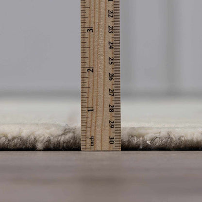 Fusao Off White Area Rug plush shag pile by Boutique Rugs with wooden ruler for scale on Tampa Home & Garden Store