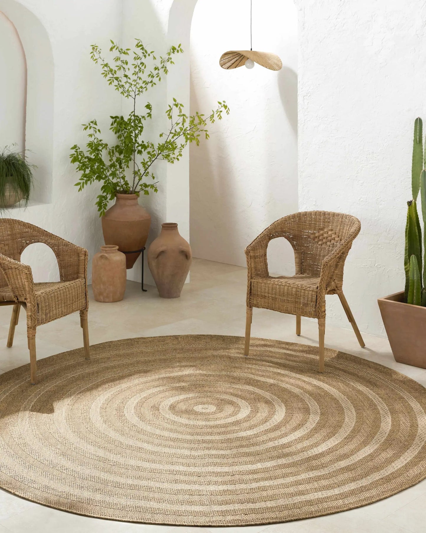 Dyami Flatweave Faux Jute Outdoor Rug by Boutique Rugs, natural beige circular braided rug on Tampa Home & Garden Store