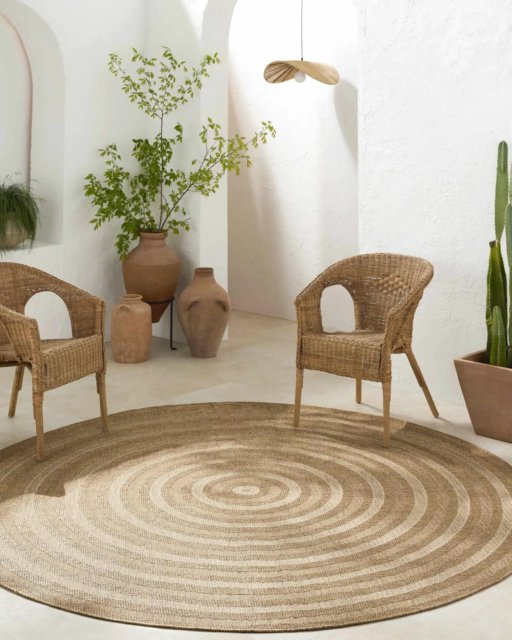 Dyami Flatweave Faux Jute Outdoor Rug by Boutique Rugs, natural beige circular braided rug on Tampa Home & Garden Store