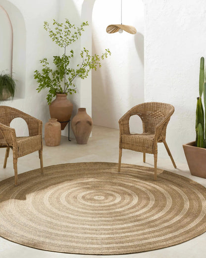 Dyami Flatweave Faux Jute Outdoor Rug by Boutique Rugs, natural beige circular braided rug on Tampa Home & Garden Store