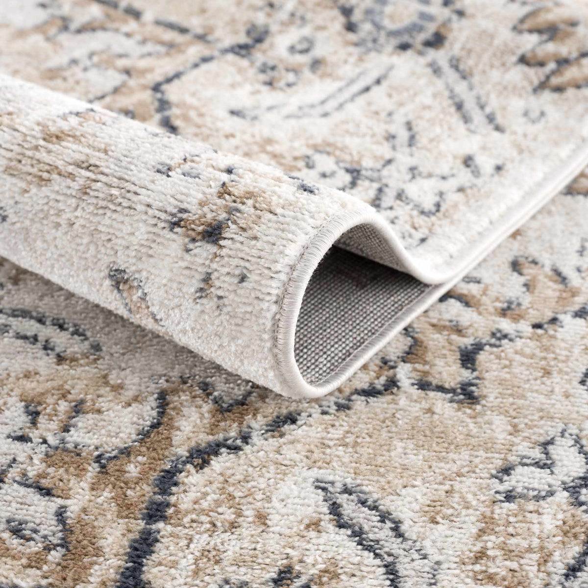 Mudgee area rug beige taupe plush pile with subtle gray geometric accents rolled edge on Tampa Home & Garden Store