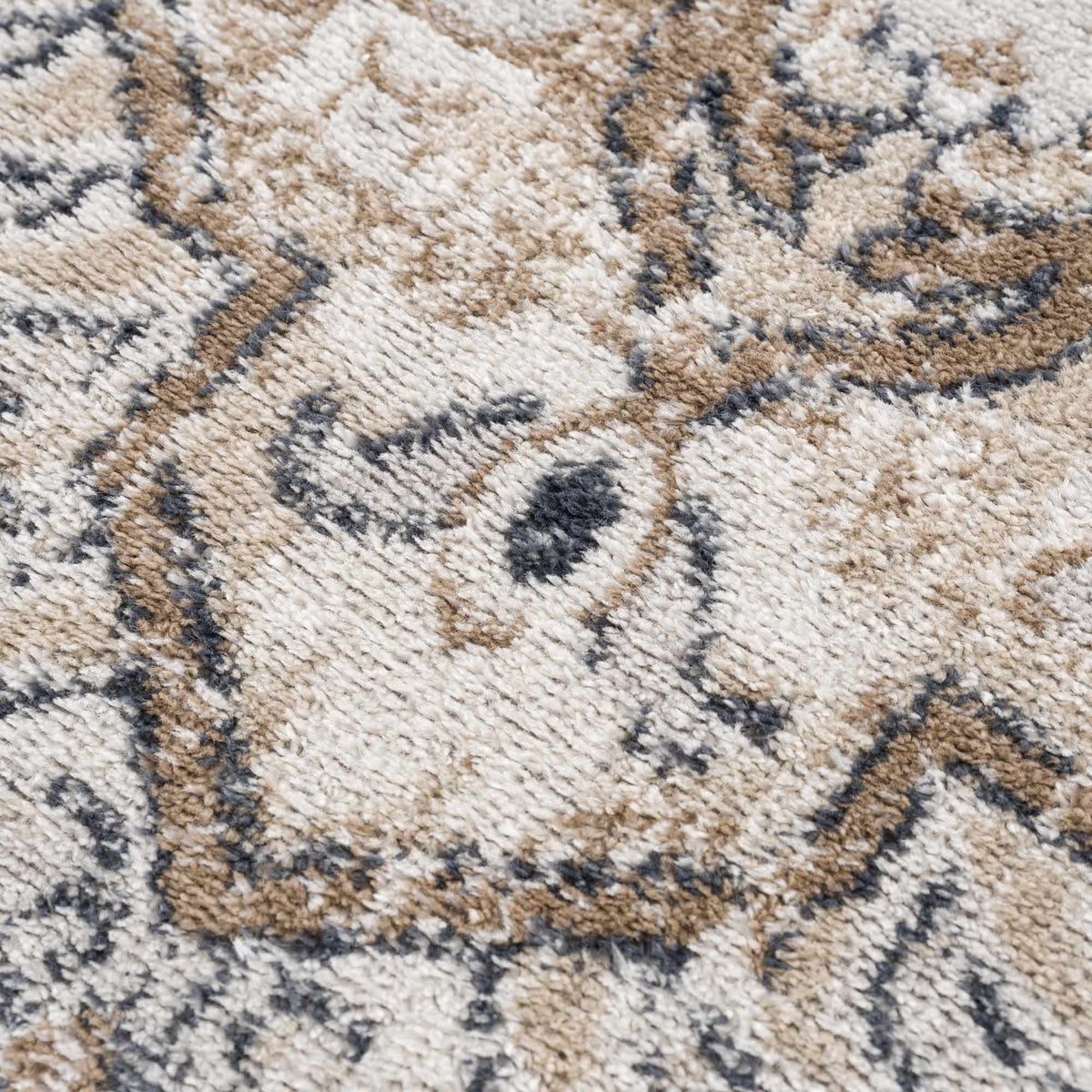 Mudgee Area Rug close up in beige tan cream with dark gray geometric pattern on Tampa Home & Garden Store