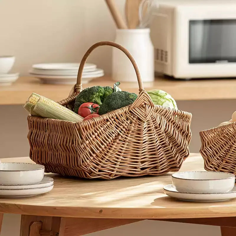 Fan Woven Market Basket in natural wicker with two handles filled with produce on table on Tampa Home & Garden Store