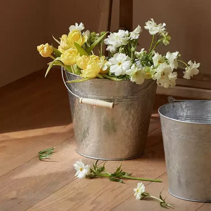 Galvanized bucket planter with yellow and white flowers in two metal buckets RusticReach on Tampa Home & Garden Store