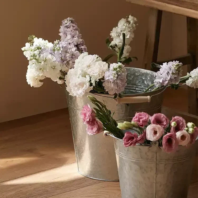 Galvanized bucket planter set with two metal buckets and white and pink blooms RusticReach on Tampa Home & Garden Store