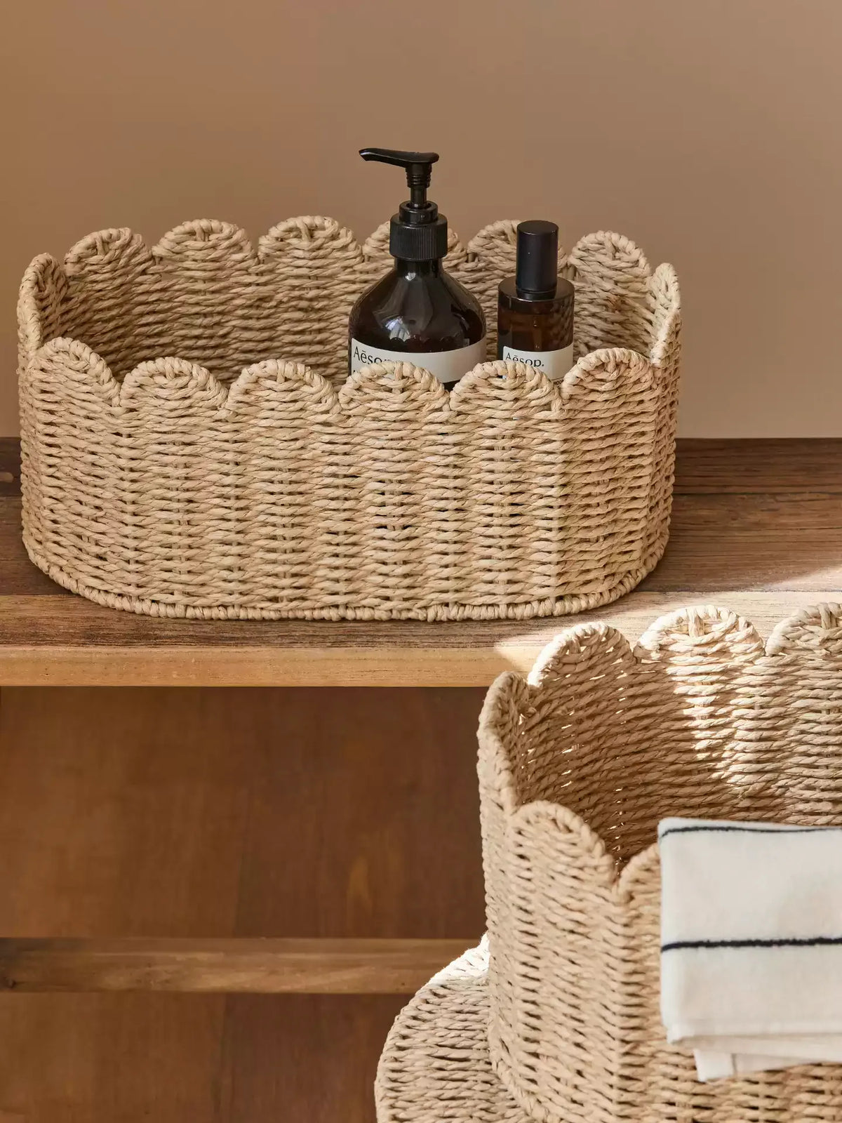 Meadow Scallop Basket by RusticReach; natural woven basket with scalloped rim holding bottles on Tampa Home & Garden Store