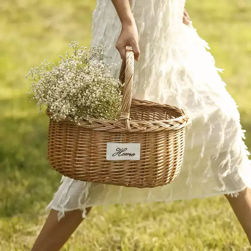 Orchard Market Basket RusticReach natural wicker basket with handle carrying white flowers on Tampa Home & Garden Store