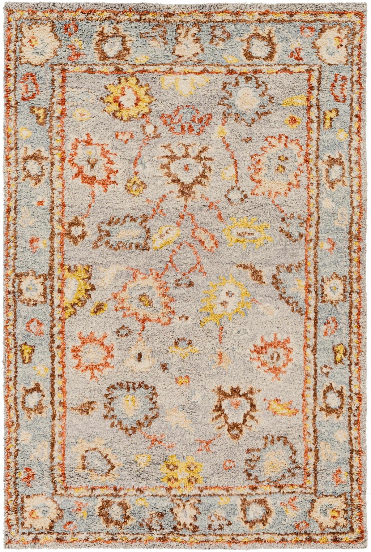 Suisun Premium Rug by Boutique Rugs, gray field with orange and yellow accents and ornate border on Tampa Home & Garden Store