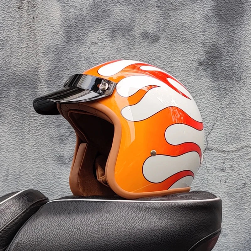Retro motorcycle helmet by BikerZoneZ in orange with flame graphics, brown lining, clear visor on Tampa Home & Garden Store