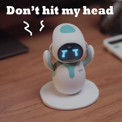 Eilik cute robot pet toy with teal accents and blue LED face, on a round white stand on Tampa Home & Garden Store