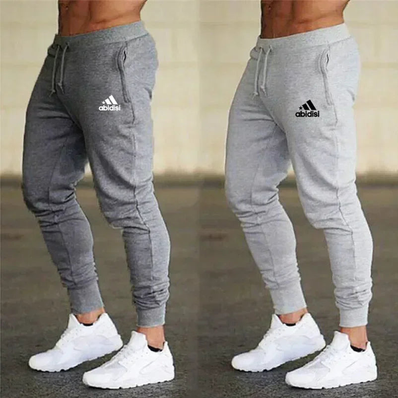 Men's gray jogger pants with drawstring waist and Adidas-style logo on thigh, 2 pairs on Tampa Home & Garden Store