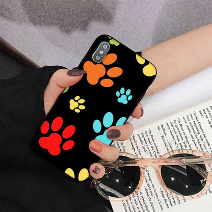 Dog paw print iPhone case black with colorful paw prints in orange red blue yellow on Tampa Home & Garden Store