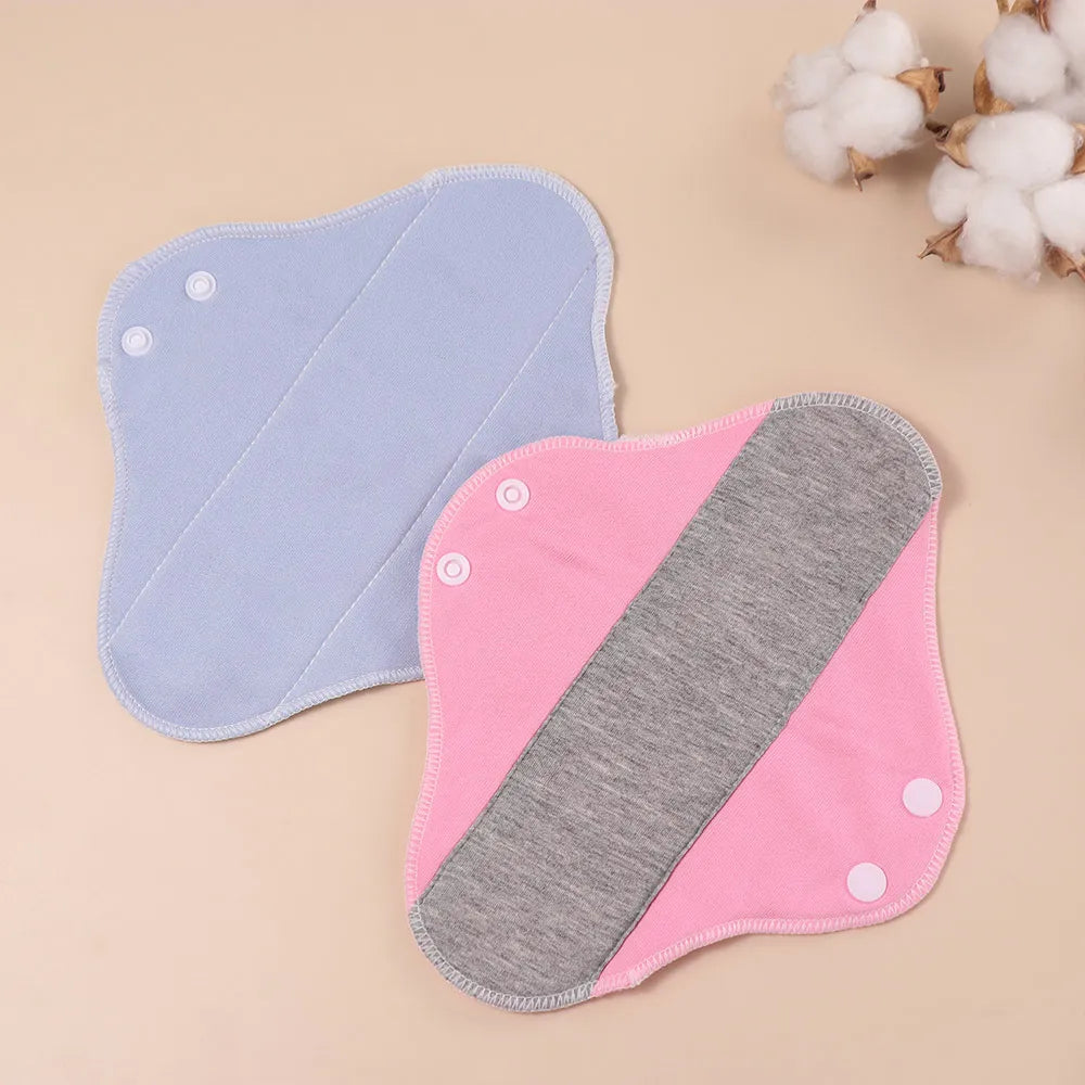Two reusable menstrual cloth pads pink with gray center stripe and blue 23cm graphene fabric on Tampa Home & Garden Store