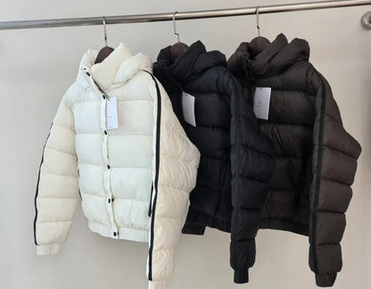 White hooded puffer jacket for women by UpTrend Deals; black and charcoal versions on rack on Tampa Home & Garden Store