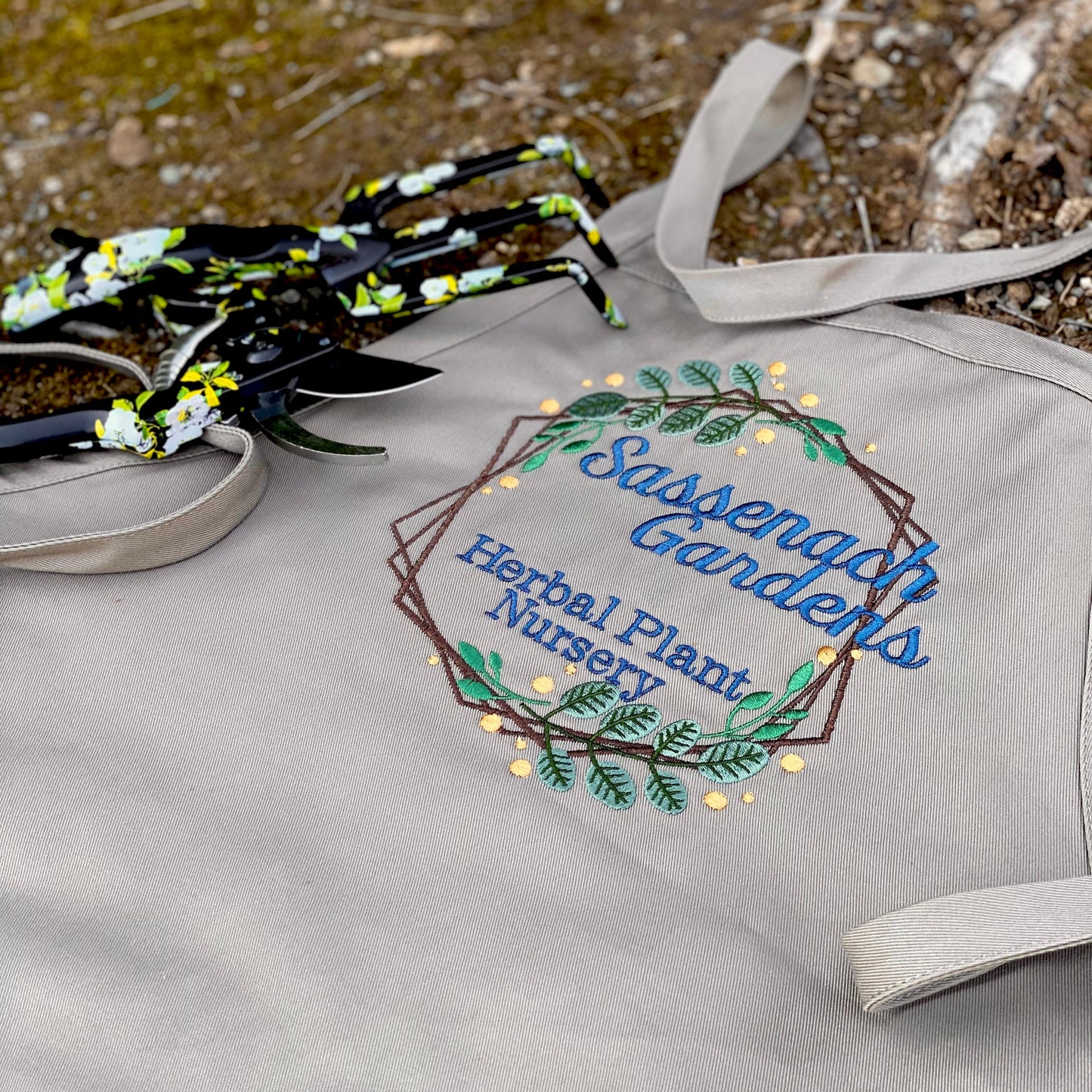 Sassenach Gardens Herbal Plant Nursery Embroidered Gardening Apron - Craftsman and Canvas Style Options - Tampa Home & Garden Store