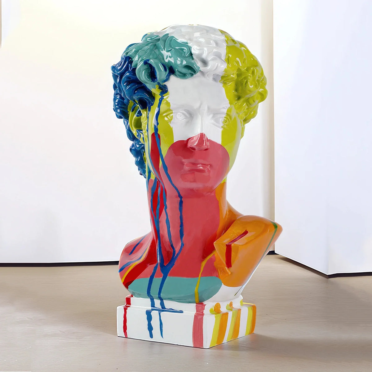 David Head resin bust sculpture by Perfecsy in bright multicolor drip paint on Tampa Home & Garden Store