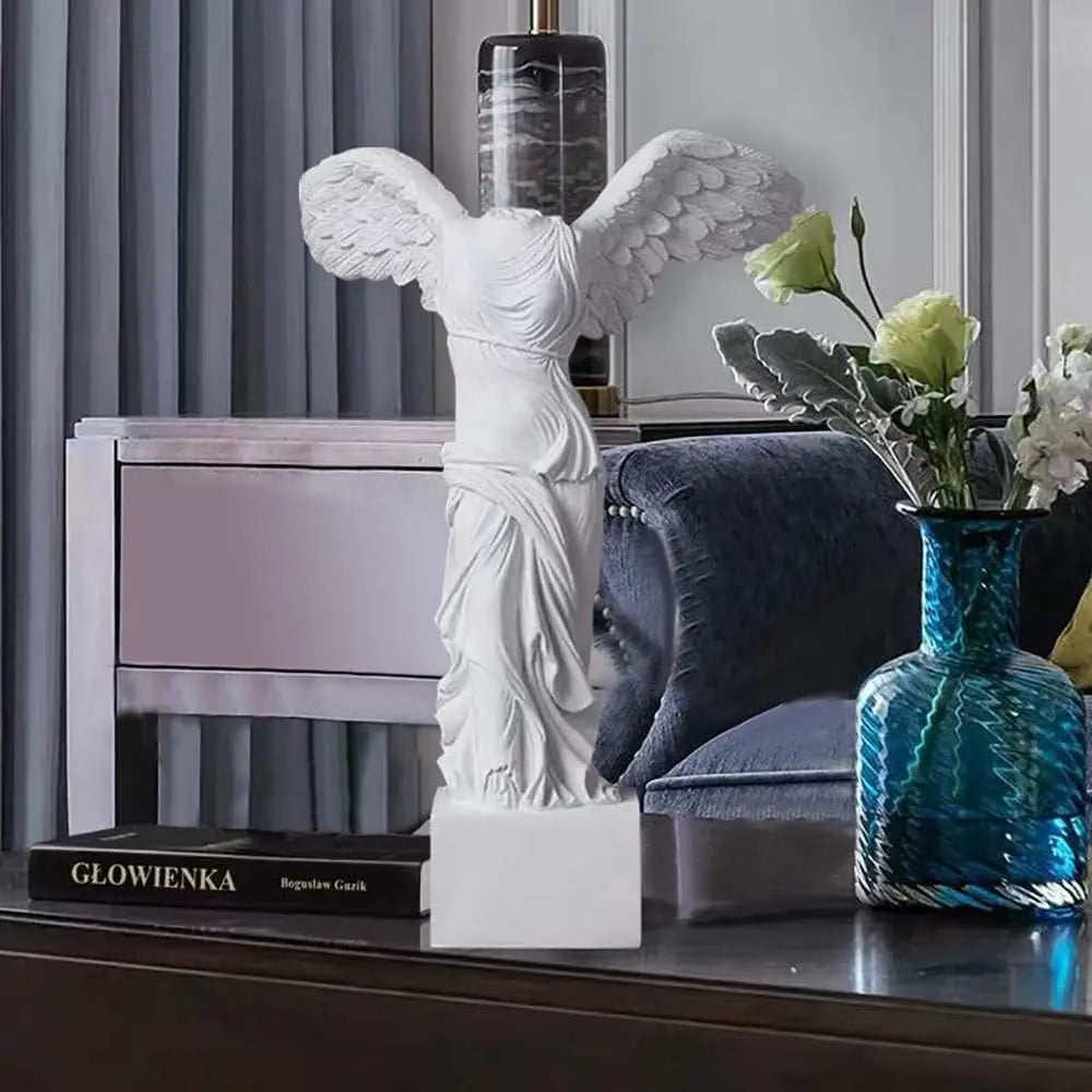 White resin Winged Victory goddess statue with flowing robes for home decor on Tampa Home & Garden Store