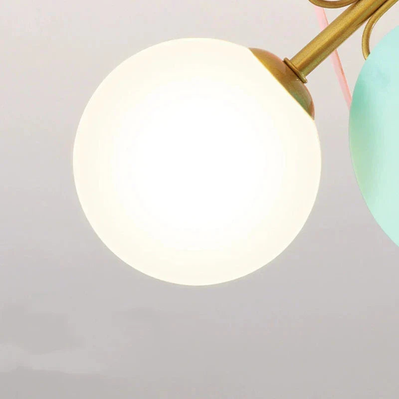 DecorBites Kids LED ceiling light with white and green glass globes on brass frame on Tampa Home & Garden Store