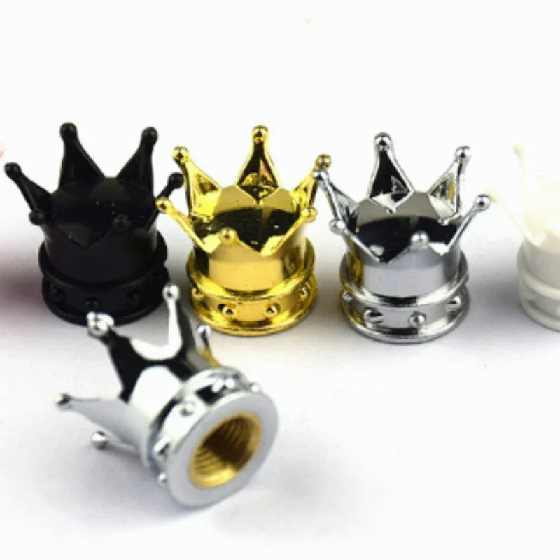 4pcs crown-shaped valve stem caps in black, gold, and silver metal with threaded interiors on Tampa Home & Garden Store