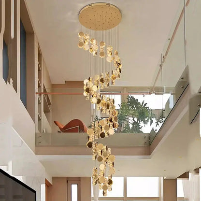 DecorBites LED pendant chandelier with gold discs cascading from a ceiling mount in living room on Tampa Home & Garden Store