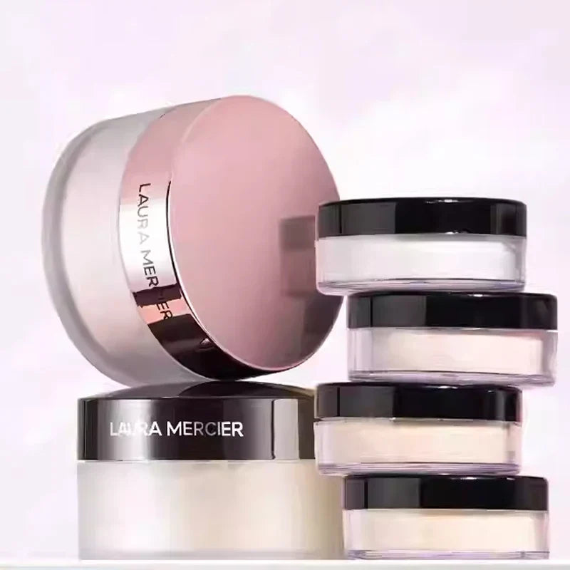 Laura Mercier loose powder makeup jars with black lids, translucent finish, stacked display on Tampa Home & Garden Store