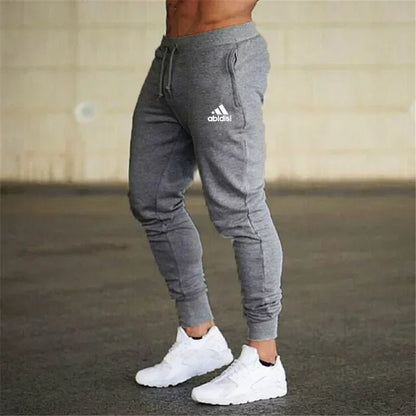 Men joggers pants gray with drawstring waist and cuffed ankles, Adidas logo on thigh on Tampa Home & Garden Store