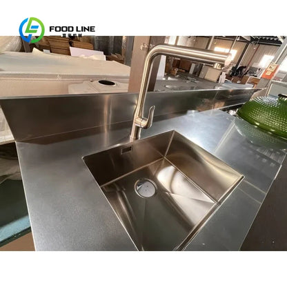Stainless steel outdoor kitchen sink with tall arc faucet and countertop Food Line logo on Tampa Home & Garden Store