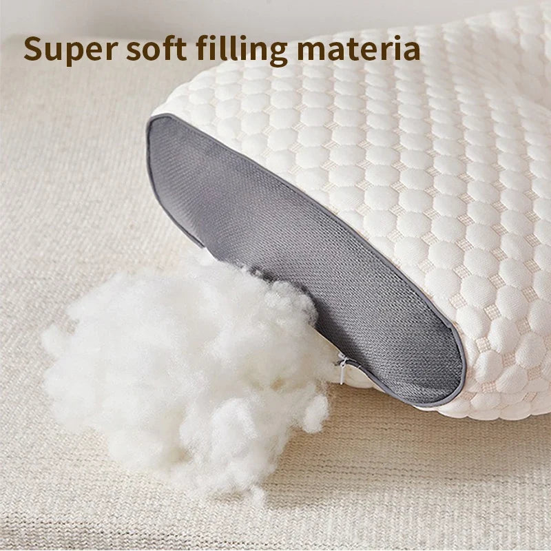 Cervical neck pillow with white hex quilted cover and plush filling spilling from zipper on Tampa Home & Garden Store