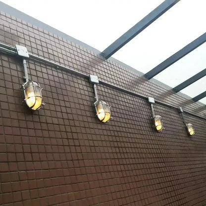 DecorBites outdoor wall lamps set, 5 lantern-style LED lights along brown tiled wall on Tampa Home & Garden Store