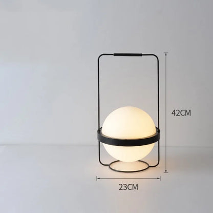 DecorBites LED Art Deco Plant Wall Light with black metal frame and glowing white globe on Tampa Home & Garden Store