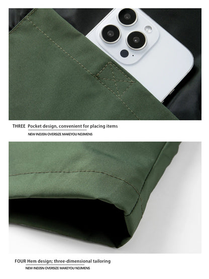 Men windproof hooded jacket in olive green with three-pocket design including phone pocket on Tampa Home & Garden Store