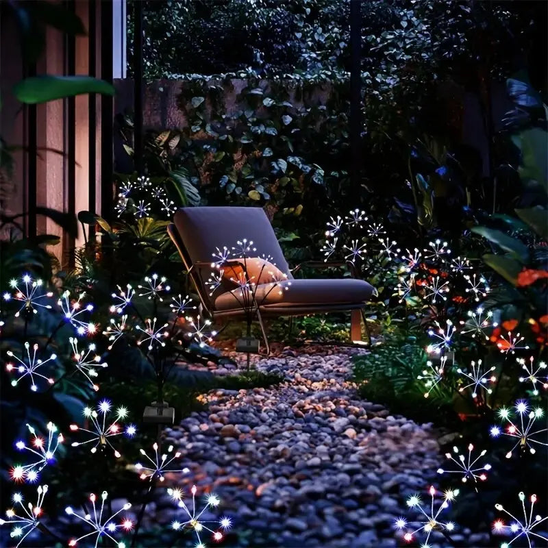 Perfecsy solar LED firework garden lights lining a pebbled walkway in a nighttime yard on Tampa Home & Garden Store