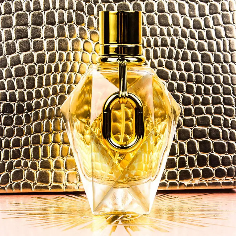 Silcy Skin Million Gold For Women EDP perfume bottle with gold cap and glass on gold snakeskin on Tampa Home & Garden Store