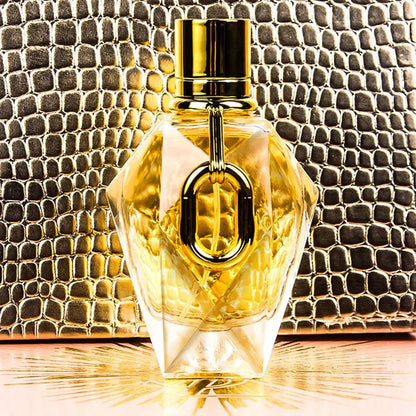 Silcy Skin Million Gold For Women EDP perfume bottle with gold cap and glass on gold snakeskin on Tampa Home & Garden Store