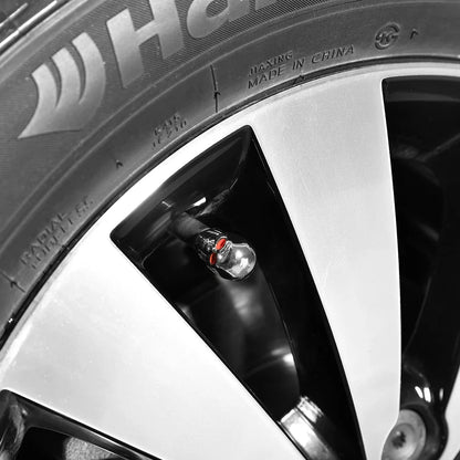 ABS Skull Valve Stem Caps by BikerZoneZ, clear skull design with red eye accents on Tampa Home & Garden Store