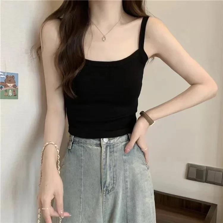 Women crop top camisole black sleeveless with spaghetti straps, paired with light denim jeans on Tampa Home & Garden Store