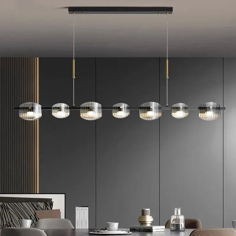 DecorBites LED pendant chandelier with 7 clear glass globes on a black metal bar on Tampa Home & Garden Store