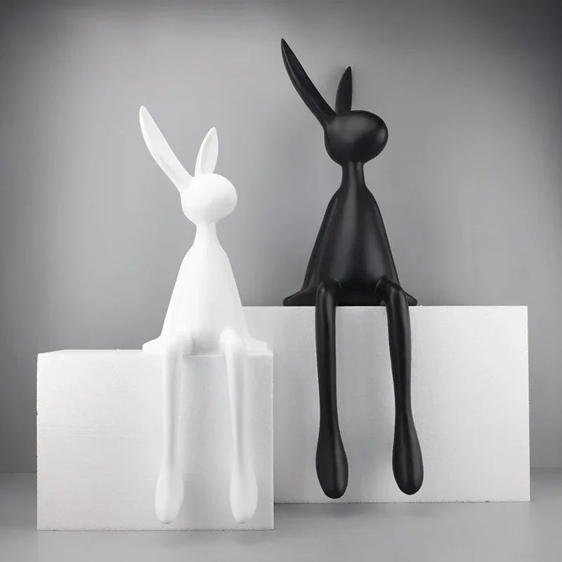 Rabbit statues by Perfecsy, abstract decor sculptures in white and black on white pedestals on Tampa Home & Garden Store