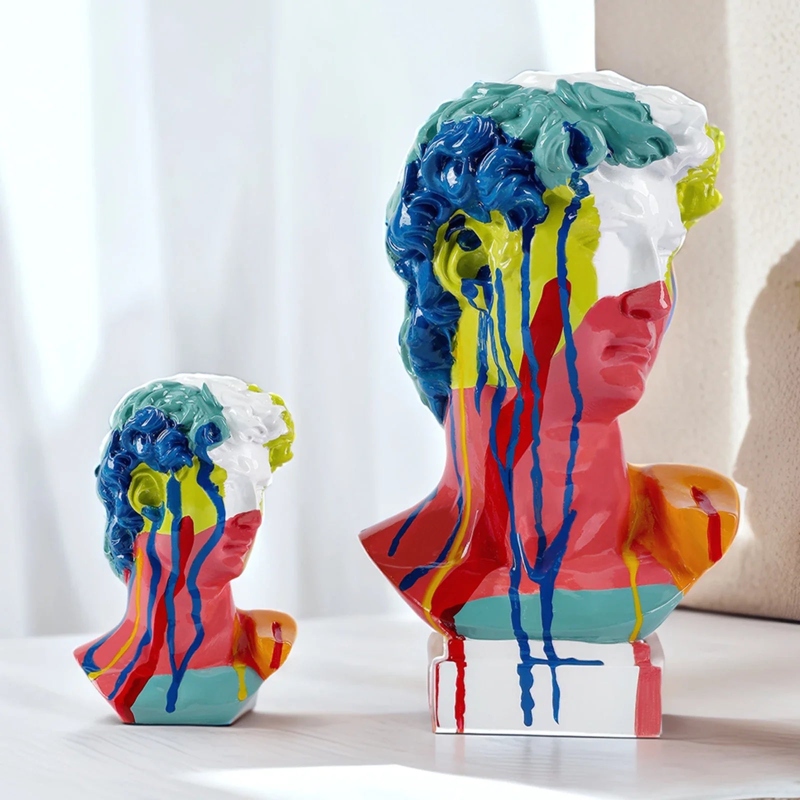 Two David Head resin busts with multicolor dripping paint for modern living room decor on Tampa Home & Garden Store